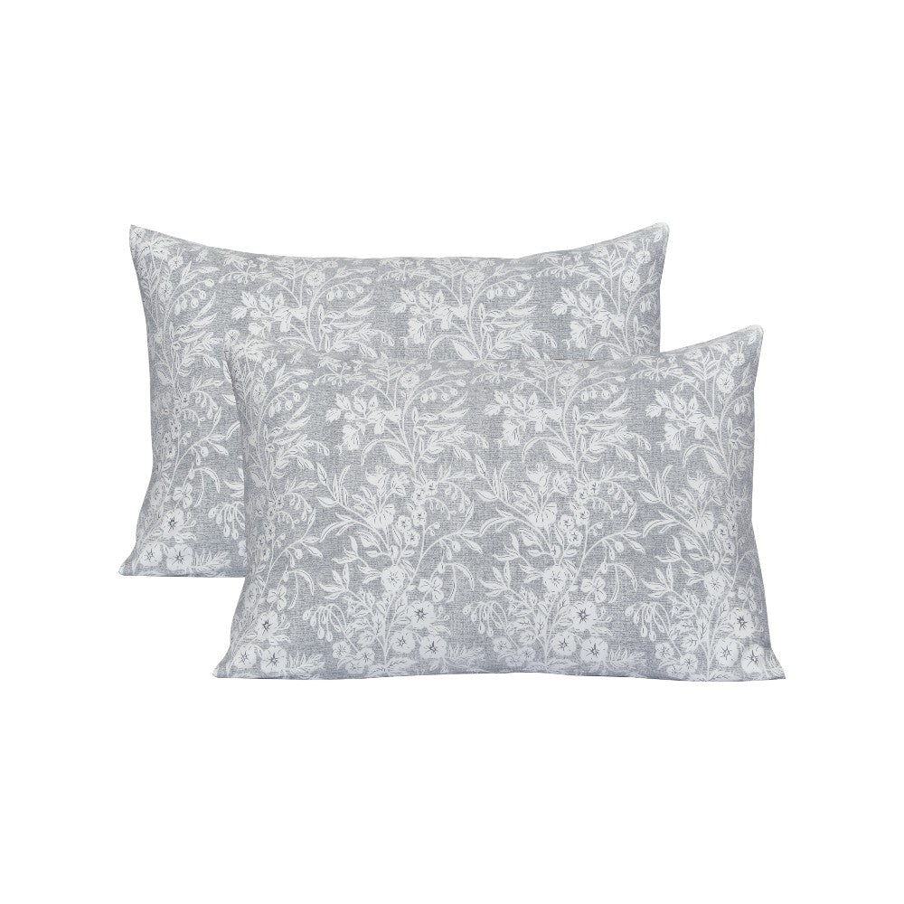 Two gray floral patterned pillows on a white background