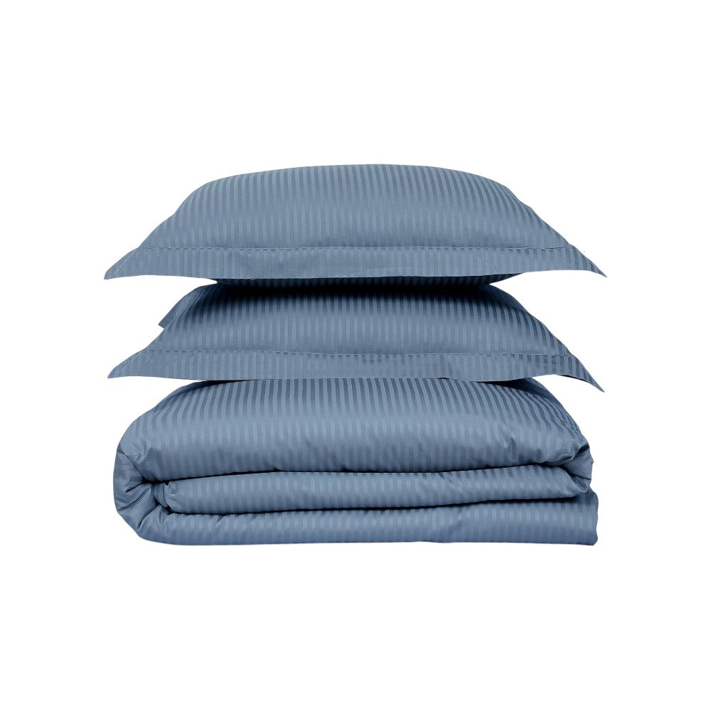 Stack of blue striped bedding on a white background