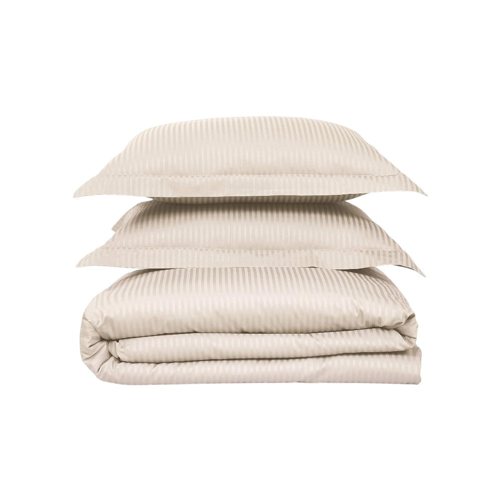 Stack of beige textured bedding on a white background